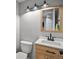 Neutral-toned bathroom featuring updated fixtures, vanity with a new countertop and sink at 21351 E Williamette Pl, Centennial, CO 80015