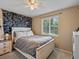 Bedroom featuring a large window and chalkboard accent wall at 21351 E Williamette Pl, Centennial, CO 80015