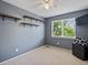 This bedroom offers shelving, a ceiling fan, and natural light from the large window at 21351 E Williamette Pl, Centennial, CO 80015