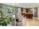 Open floor plan with eat-in kitchen showcasing counter seating and stainless steel appliances at 21351 E Williamette Pl, Centennial, CO 80015