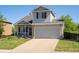 Well-maintained two-story home showcasing a classic design and attached two-car garage at 21351 E Williamette Pl, Centennial, CO 80015