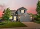 Charming two-story home with a well-manicured lawn, lovely landscaping and an attached two-car garage at 21351 E Williamette Pl, Centennial, CO 80015