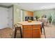 Kitchen island with breakfast bar seating, adjacent to dining area at 21351 E Williamette Pl, Centennial, CO 80015