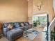 Inviting living room with high ceilings, comfortable seating, and a view into the dining area at 21351 E Williamette Pl, Centennial, CO 80015