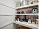 Organized walk-in pantry featuring lots of shelving and storage at 21351 E Williamette Pl, Centennial, CO 80015