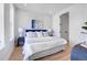 Inviting bedroom with a plush bed, stylish decor, and ample natural light at 5148 W 44Th Ave, Denver, CO 80212