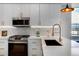 Modern kitchen features sleek cabinets, stainless steel appliances, and stylish fixtures for a chef-inspired space at 5148 W 44Th Ave, Denver, CO 80212