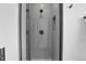 Modern shower stall with gray subway tile, featuring sleek fixtures and a built-in niche for toiletries at 5148 W 44Th Ave, Denver, CO 80212