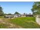 Spacious backyard with a camper and boat on the property, a large lawn, and two storage sheds at 4244 W Monmouth Ave, Littleton, CO 80123