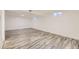 Finished basement with modern flooring and natural light from windows at 4244 W Monmouth Ave, Littleton, CO 80123