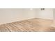 Finished basement with modern flooring and natural light from two windows at 4244 W Monmouth Ave, Littleton, CO 80123