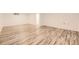 Finished basement featuring modern flooring and a doorway at 4244 W Monmouth Ave, Littleton, CO 80123