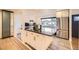 Kitchen boasts stainless appliances, center island, and white cabinetry, great light at 4244 W Monmouth Ave, Littleton, CO 80123