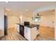 Spacious living room featuring views into kitchen, hardwood floors and neutral walls at 4244 W Monmouth Ave, Littleton, CO 80123