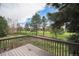 Back deck with beautiful view of a park with mature trees at 6780 W 84Th Cir # 66, Arvada, CO 80003