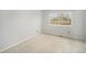 Cozy bedroom featuring carpet flooring, neutral paint, and a window with a view at 6780 W 84Th Cir # 66, Arvada, CO 80003