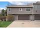 Exterior elevation featuring a two car garage and driveway at 6780 W 84Th Cir # 66, Arvada, CO 80003