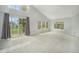 Bright and spacious living room with vaulted ceilings, large windows, and a sliding door to the backyard at 6780 W 84Th Cir # 66, Arvada, CO 80003