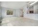 Open-concept living room featuring neutral walls, a window, and view to the kitchen at 6780 W 84Th Cir # 66, Arvada, CO 80003
