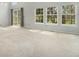 Expansive living area with neutral carpet, large windows, and natural light, perfect for relaxation and entertaining at 6780 W 84Th Cir # 66, Arvada, CO 80003