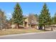 The home has a manicured front lawn at 7957 Towhee Rd, Parker, CO 80134