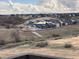 Picturesque view of a new home community against a backdrop of rolling hills and distant snow-capped mountains at 4225 Ridgewalk Pt, Castle Rock, CO 80108