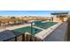 Community swimming pool with a large deck and covered seating at 4225 Ridgewalk Pt, Castle Rock, CO 80108