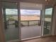 This home features sliding glass doors that open onto a large deck with stunning landscape views at 4225 Ridgewalk Pt, Castle Rock, CO 80108