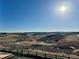 Bright view of rolling terrain and landscape shows the land and homes beyond at 4225 Ridgewalk Pt, Castle Rock, CO 80108