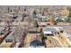 Aerial view showcasing the home and neighborhood with tree lined streets at 2550 Kendall St, Edgewater, CO 80214