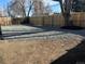 Wide backyard featuring privacy fence and gravel area, ready for landscaping at 2550 Kendall St, Edgewater, CO 80214