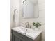 Cozy bathroom featuring a white vanity, vessel sink and decorative shiplap wall at 2550 Kendall St, Edgewater, CO 80214