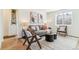 Cozy living room with stylish furniture, modern art, and an area rug, creating a warm and inviting atmosphere at 2550 Kendall St, Edgewater, CO 80214