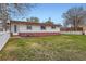 Backyard with a well-maintained lawn and white picket fence surrounding the property at 5294 S Prescott St, Littleton, CO 80120