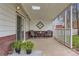Covered patio features seating and garden space, perfect for outdoor relaxation at 5294 S Prescott St, Littleton, CO 80120