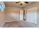 Spacious bedroom with fan, large closet, neutral paint, and tan carpet at 5294 S Prescott St, Littleton, CO 80120