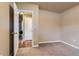 Comfortable bedroom with carpet and door to a neighboring room at 5294 S Prescott St, Littleton, CO 80120