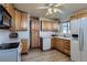Functional kitchen with wood cabinetry, marble countertops, and modern appliances at 5294 S Prescott St, Littleton, CO 80120
