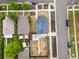 Aerial view of home with solar panels, lush landscaping, and backyard pergola at 3458 N Clayton St, Denver, CO 80205