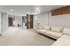 Expansive basement featuring a cozy seating area, carpet, and ample natural light, ideal for relaxation and entertaining at 3458 N Clayton St, Denver, CO 80205
