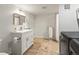 Bright bathroom featuring a modern vanity, tile flooring, and towel rack, offering a clean and functional space at 3458 N Clayton St, Denver, CO 80205