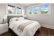 Sun-drenched bedroom with hardwood floors and ample natural light streaming through the large windows at 3458 N Clayton St, Denver, CO 80205