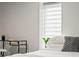 Cozy bedroom with a plush bed, a modern side table, and bright natural light, offering a comfortable and inviting atmosphere at 3458 N Clayton St, Denver, CO 80205