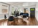 Bright living room with hardwood floors, fireplace, ample natural light, and adjacent dining area at 3458 N Clayton St, Denver, CO 80205