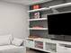 Living room with a modern entertainment center and open shelves, offering stylish storage and display options at 3458 N Clayton St, Denver, CO 80205