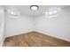 The finished basement offers flexible space with hardwood floors and a single window for natural light at 4434 Grove St, Denver, CO 80211