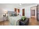 Comfortable bedroom featuring hardwood floors, neutral tones, and ample closet space at 4434 Grove St, Denver, CO 80211