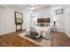 Comfortable bedroom with hardwood floors, natural light, and stylish decor at 4434 Grove St, Denver, CO 80211