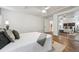 Bedroom with hardwood floors and a mirrored closet; the staircase is visible through an open door at 4434 Grove St, Denver, CO 80211