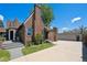 Lovely brick house showcasing an interesting roof line, a detached garage and a spacious yard at 4434 Grove St, Denver, CO 80211